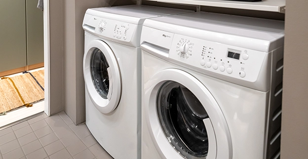 A picture of a white front loading washer and dryer.