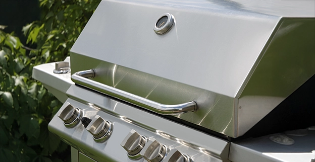 A closeup shot of a gas grill.