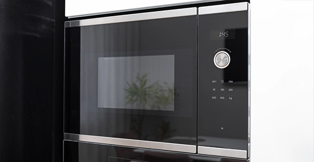 Close up of black microwave.