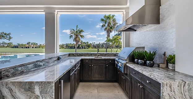 Outside kitchen set up with a golf course in background.