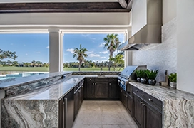 Outside kitchen set up with a golf course in background.
