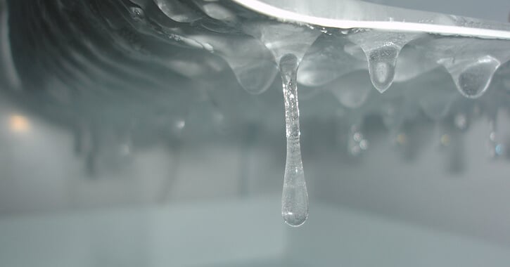 Close-up of frozen water drops in ice maker