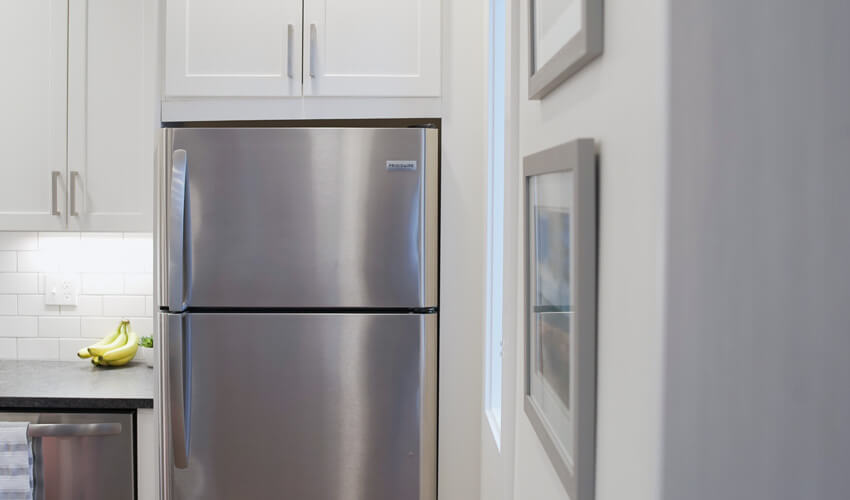 Refrigerator next to the wall