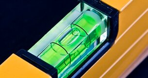 The center of a leveler where the green fluid with a bubble is.