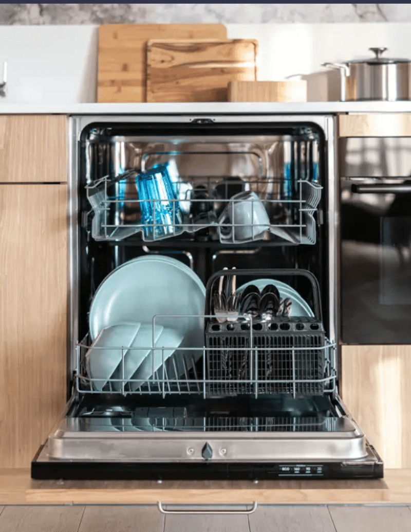 Front view of a loaded dishwasher.