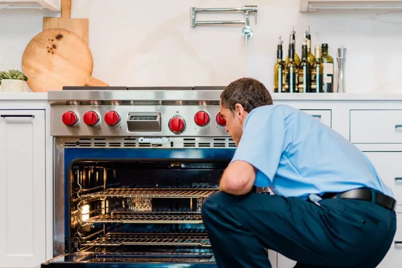 Mr. Appliance professional completing a convection oven repair in League City, TX